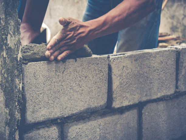 istock Brick Builders Are Building Walls 671330730