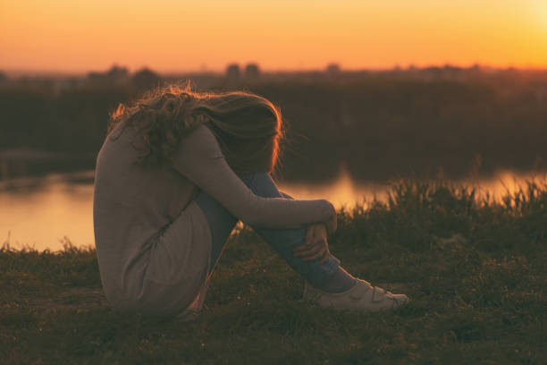 istock Sad woman at the sunset 671334886