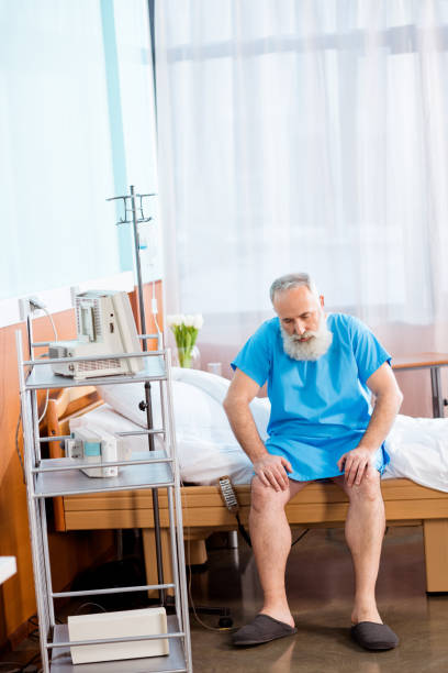 istock Senior man on hospital bed 671335110