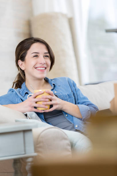 istock Woman enjoys her new home 671337696