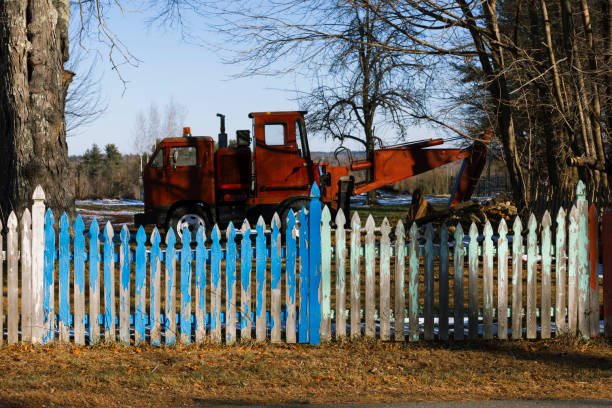 Colorful picket fence on a farmland.