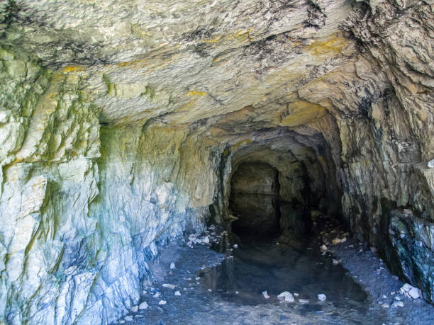 istock rocky wet dark tunnel 671346374