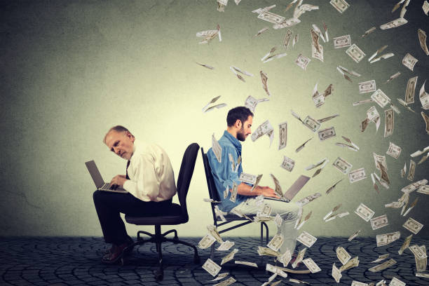 istock Employee compensation economy. Young and old man working on laptop 671352488