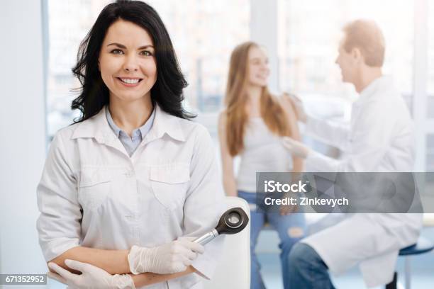 Happy Young Patient Having Conversation With Dermatologist The Hospital Stock Photo - Download Image Now