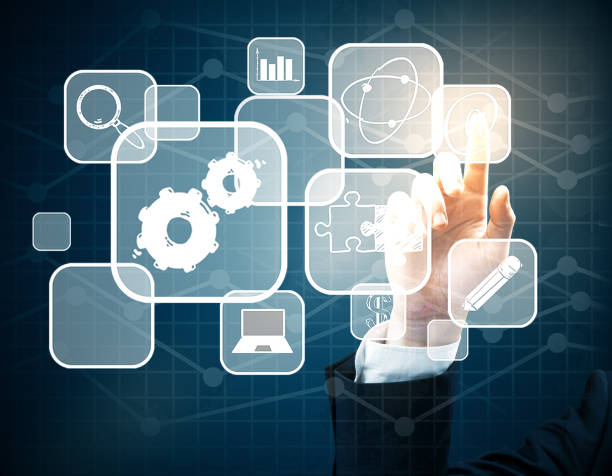 istock Hand pointing at business icons 671356452