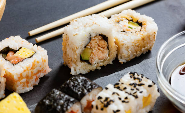 istock Slate tray of assorted sushi 671357228