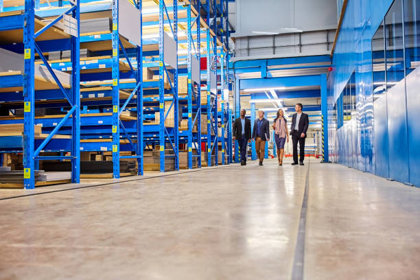 istock Business team walking together in warehouse 671360728