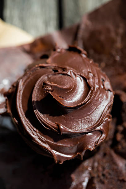 istock Chocolate muffin with frosting 671361542