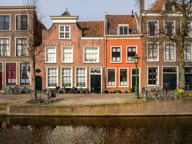 Leiden Shot from the water, the Vliet, in the historical centre"ncanals with historical houses in the dutch city of Leiden. Birthplace of Rembrandt van Rijn.This image is GPS tagged