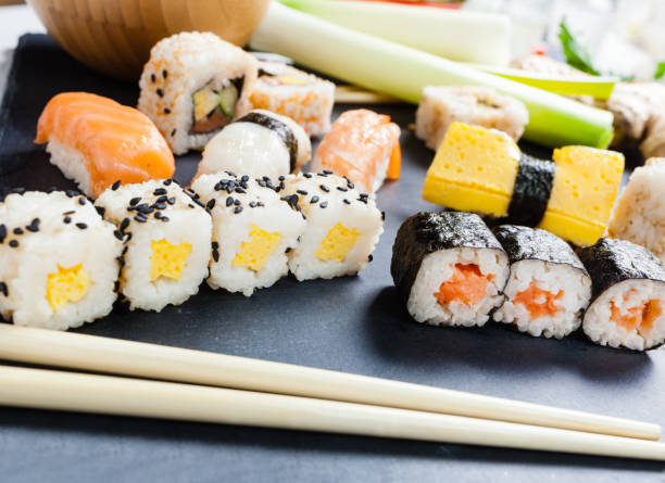 istock Slate tray of assorted sushi 671365574