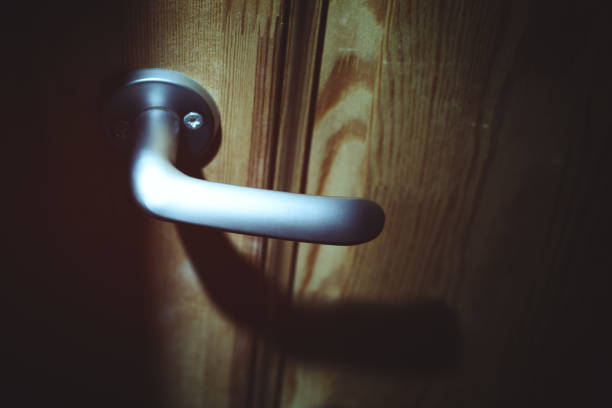 istock Closed door at home during the night 671372352