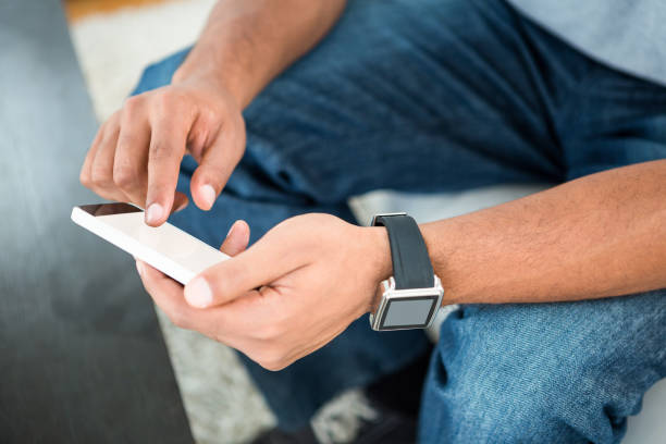 istock Close-up of man scrolling on phone 671372702