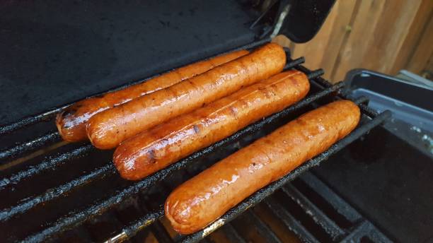 istock Hot Dogs On Grill 671372990