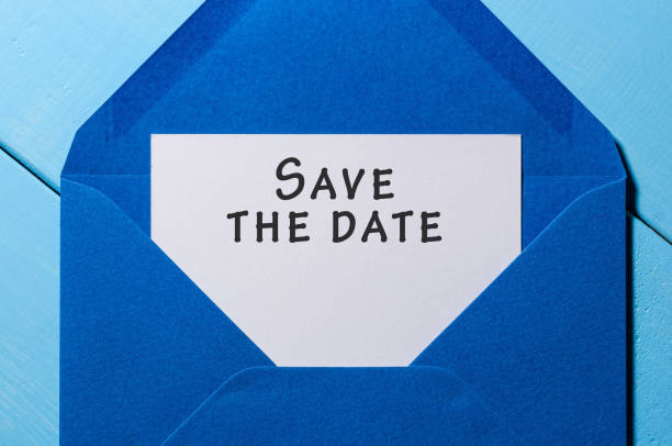 istock Text Save the date on white paper at blue envelope. business concept 671376112