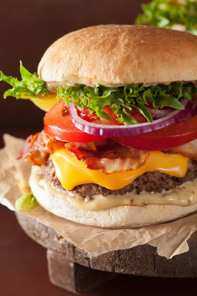 istock bacon cheese burger with beef patty, tomato and onion 671376282