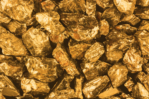 istock Golden nuggets closeup. Background textured 671377562