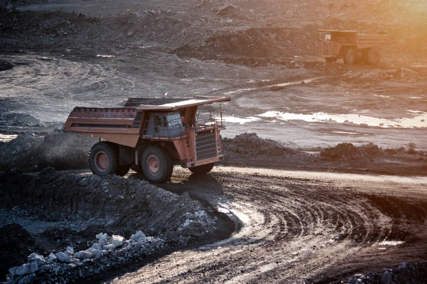 istock coal-preparation plant. Big mining truck at work site coal transportation 671377630