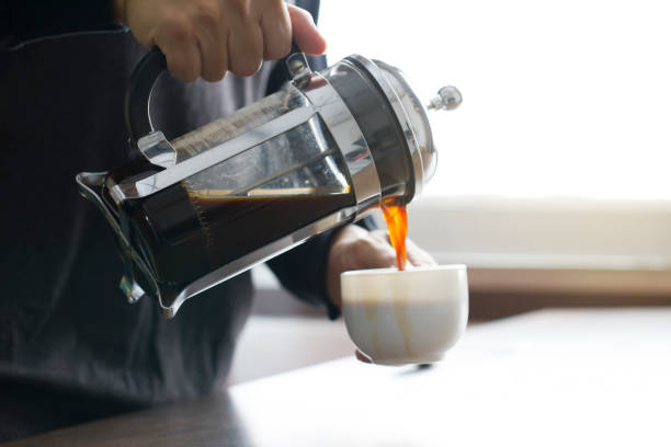 istock Pouring coffee from French press coffee maker 671381972