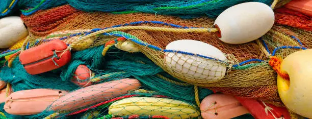 Photo of background of colorful fishing nets and floats
