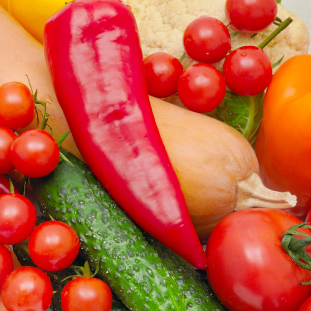 istock bright background of ripe vegetables and herbs 671393700