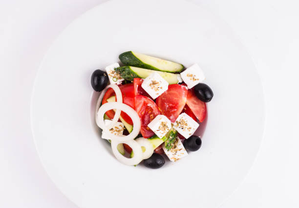 istock fresh vegetable salad isolated on white background 671394198