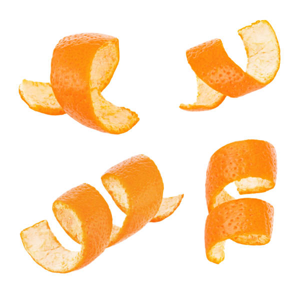 Set of curl orange peel isolated on white background Set of curl orange peel isolated on a white background. Full depth of field peeling food stock pictures, royalty-free photos & images