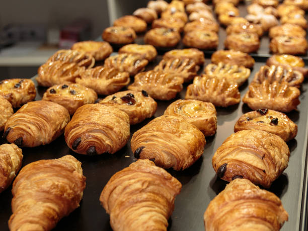 istock Fresh Croissants Assortment in Line for Continental Breakfast 671415704