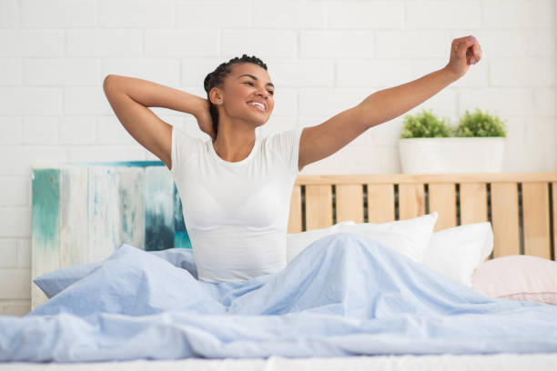 istock African woman starting her morning with stretching 671416238