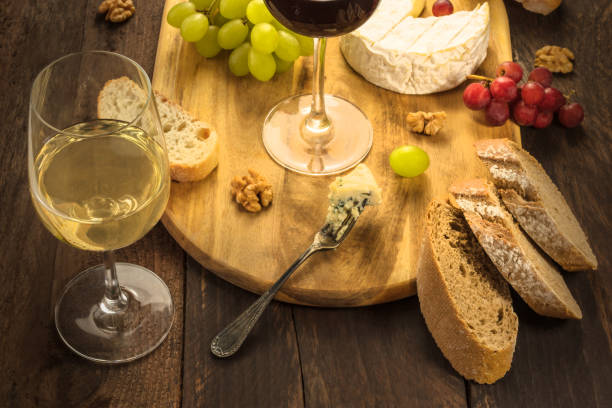 istock Wine and cheese tasting with bread and grapes 671418778