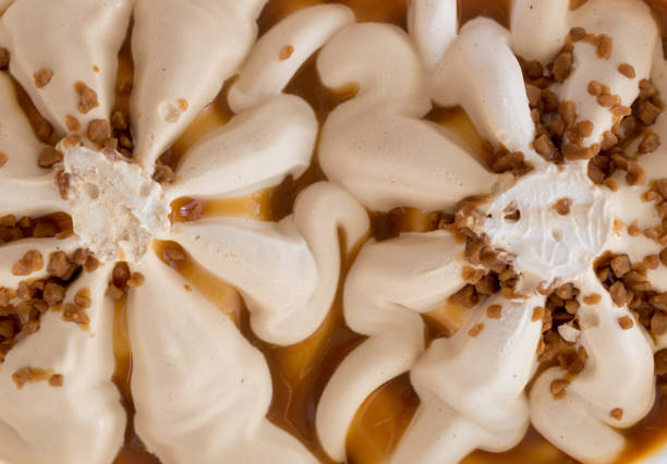 istock Vanilla ice cream with walnuts,banana and salty caramel 671425230