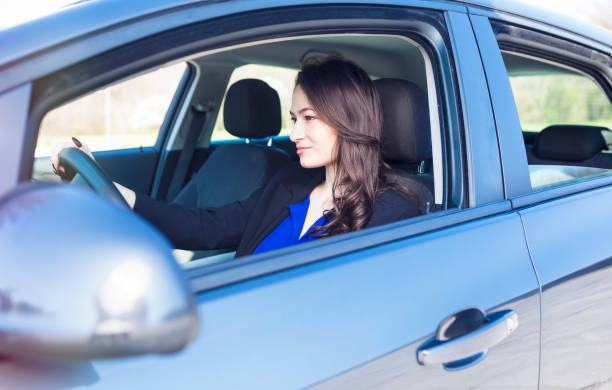 istock Woman driving a car 671427294