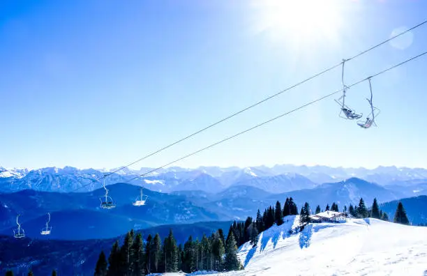 mountains with modern ski lift chairs