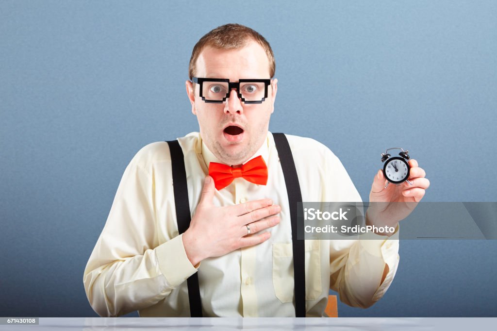 Nerd Alarm Surprised Nerd Guy Holding Small Alarm Clock Stock Photo - Download ...