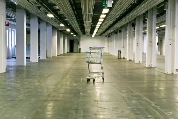 Photo of Empty Abandoned Warehouse with Shopping Cart