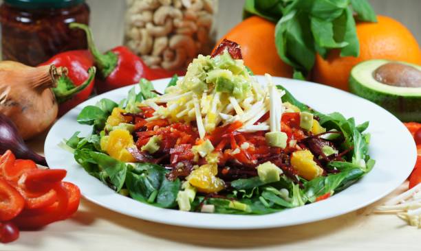 istock Beet Orange Salad With Greens and Avocado 671451690