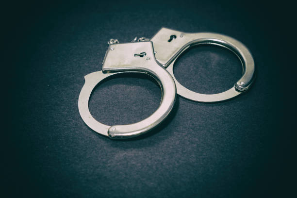 istock Pair of metal handcuffs 671459712