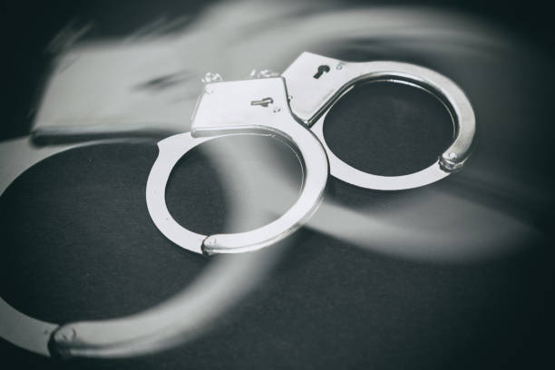 istock Pair of metal handcuffs 671462008