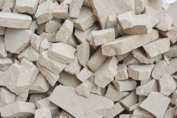 istock A pile of stones. Unusual background from broken gray bricks 671462244