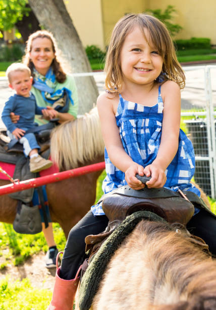 istock Mature woman having fun with her children 671465718