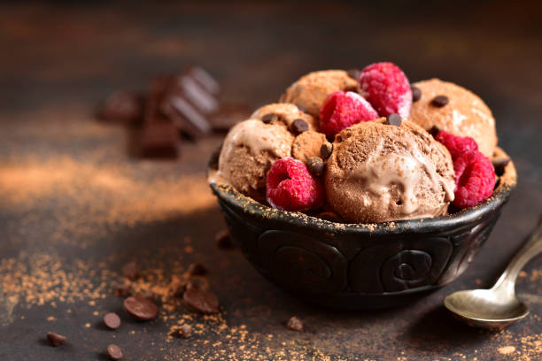 istock Homemade chocolate ice cream with raspberry and chocolate chips. 671472782