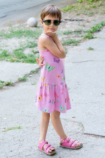 istock Little girl with oversized sunglasses 671473174