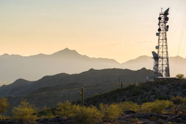 Radio Tower in the Desert Photo of a radio/cell tower in the mountains of the Arizona desert mobile phone mast stock pictures, royalty-free photos & images