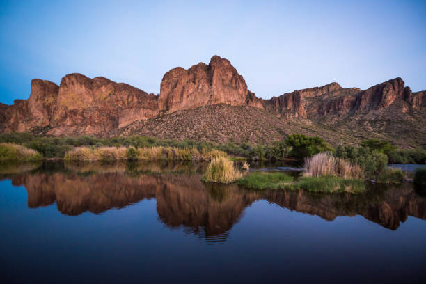 Mountains Reflected in the Salt River Photo of mountains rising from and reflected in the Salt River at dusk near Phoenix, Arizona, USA salt river photos stock pictures, royalty-free photos & images