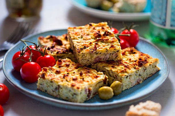 Frittata with bacon, courgette, feta stock photo