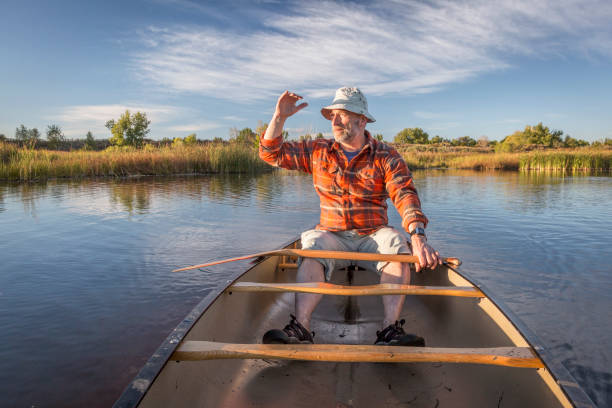 istock enjoying evening canoe paddling 671476790