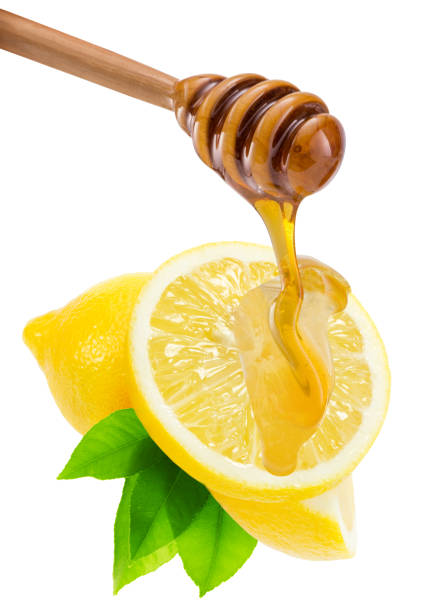 istock dripping honey on lemons isolated on a white background 671481986