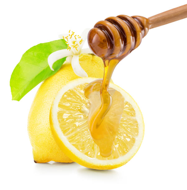 istock dripping honey on lemons isolated on a white background 671482060