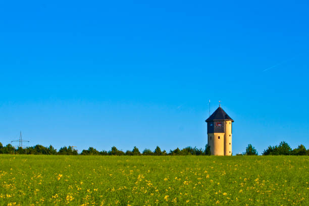 istock water tower in beautiful landscape with blue sky 671484878