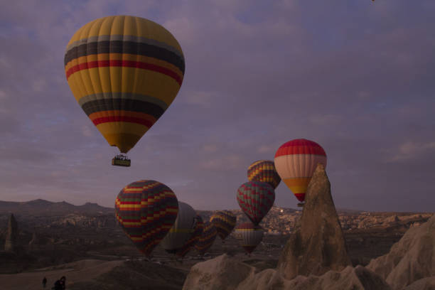 istock Strange stone formations, Cappadocia, Turkey. People during journey to Cappadocia 671492726