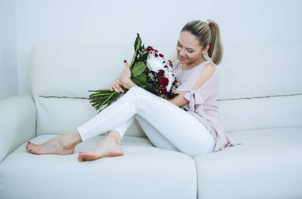 istock Woman holding flowers 671494372